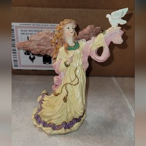 Angel with dove sculpture